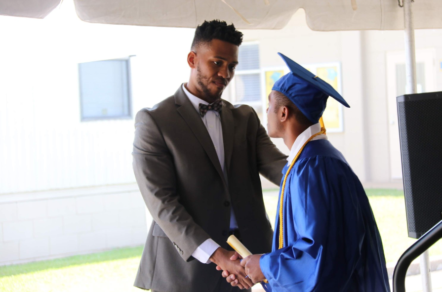 Terrell Blount congratulating new graduate